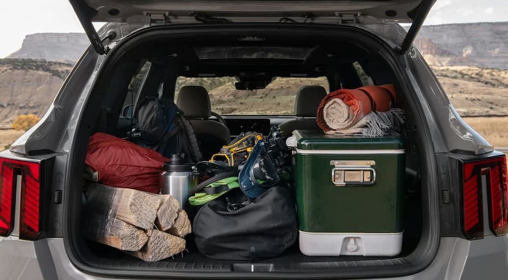 Camping gear in the rear cargo area of a 2026 Kia Sorento.