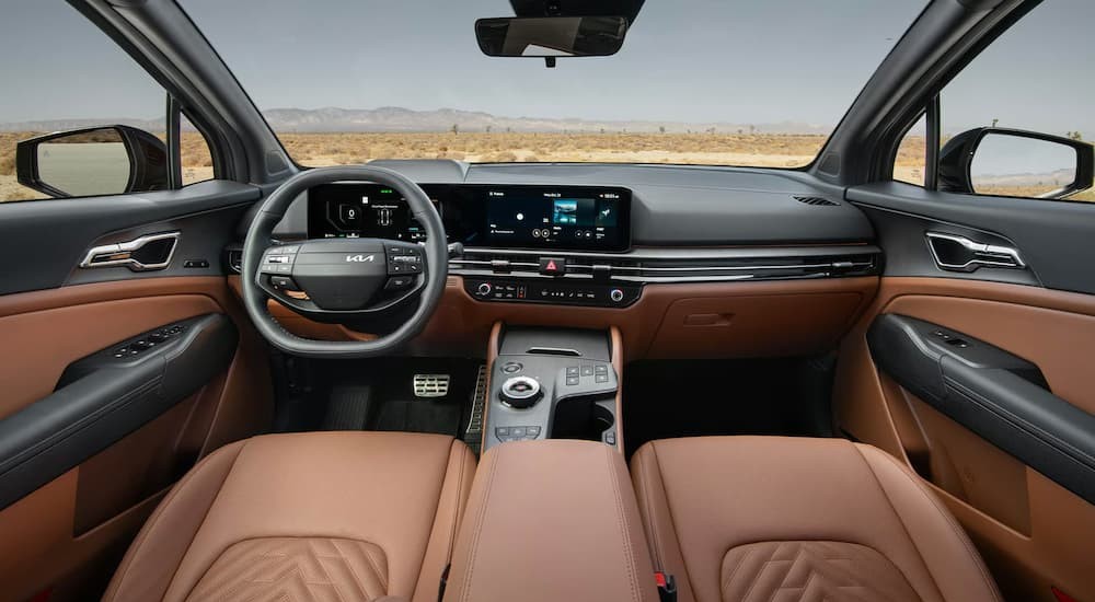 The black and tan interior and dash in a 2026 Kia Sportage for sale.