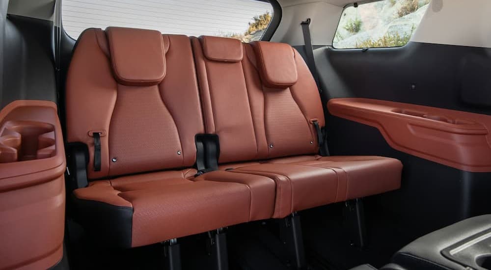 The brown rear interior in a 2026 Kia Carnival.