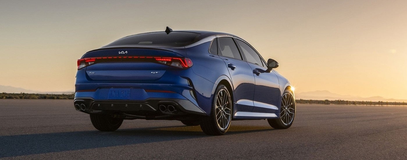 Blue 2024 Kia K5 GT parked at dusk