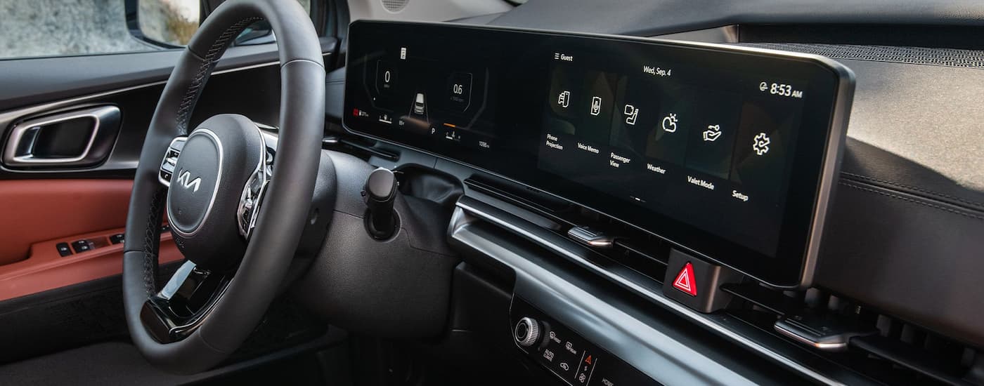 Steering wheel and dash in the interior of a 2026 Kia Carnival
