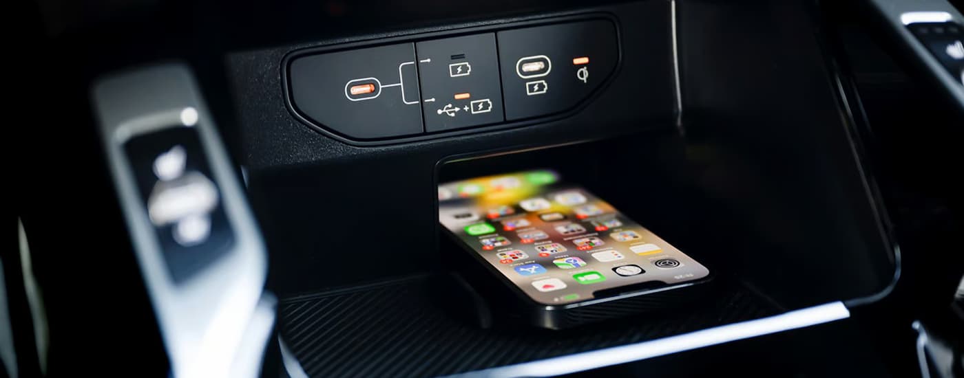 Phone charging and storage section in a 2026 Kia Sorento