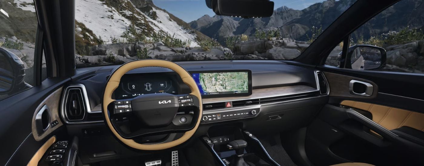Interior view of 2026 Kia Sorento X-Pro SX Prestige infotainment display and steering.