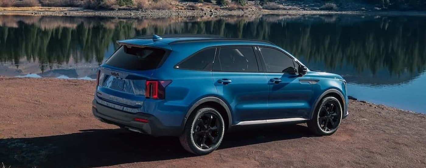 A blue 2026 Kia Sorento parked near water