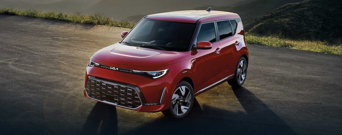A red 2025 Kia Soul parked offroad.