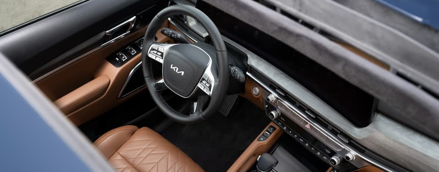 The black and tan interior and dash in a 2027 Kia Telluride for sale.