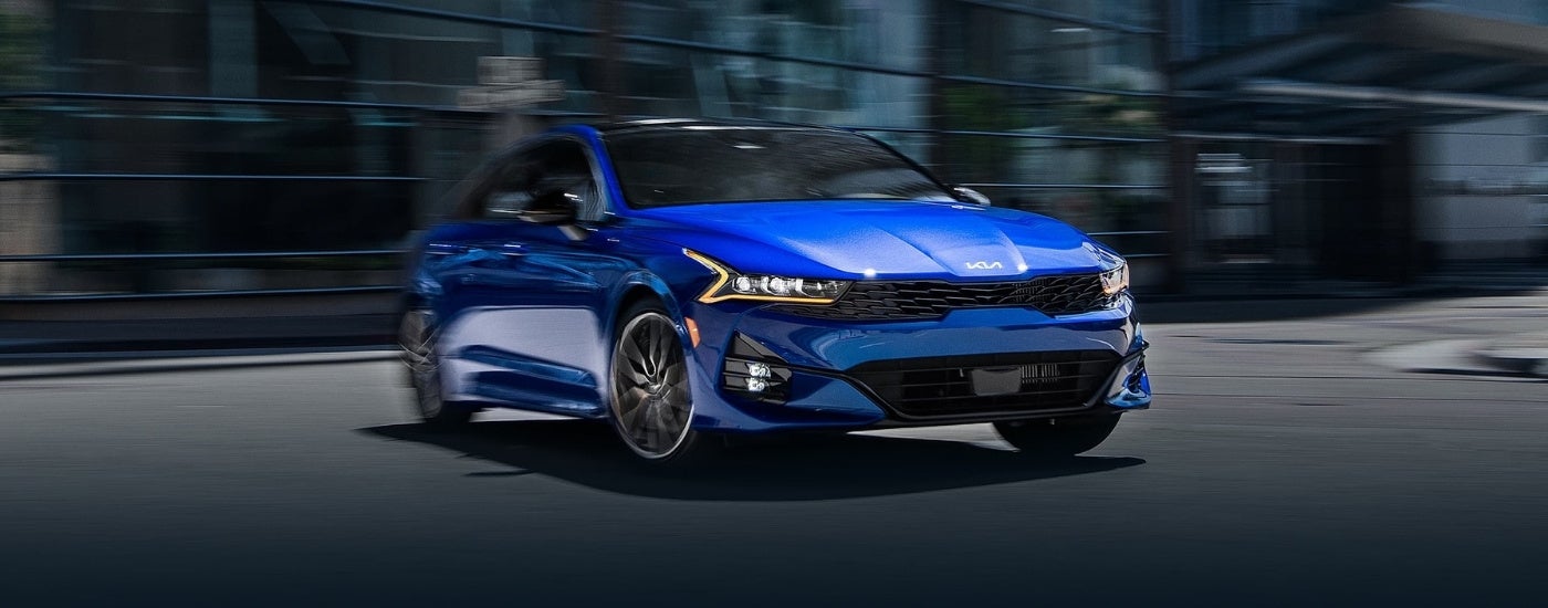 A blue 2025 Kia K5 for sale from a dealer